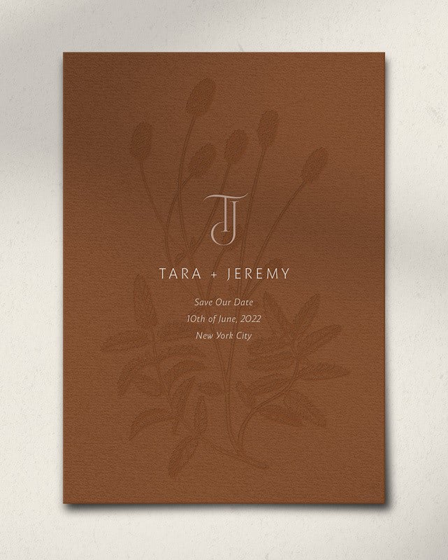 Bliss & Bone terracotta save the date card with botanical accent and modern typography, flat lay product shot